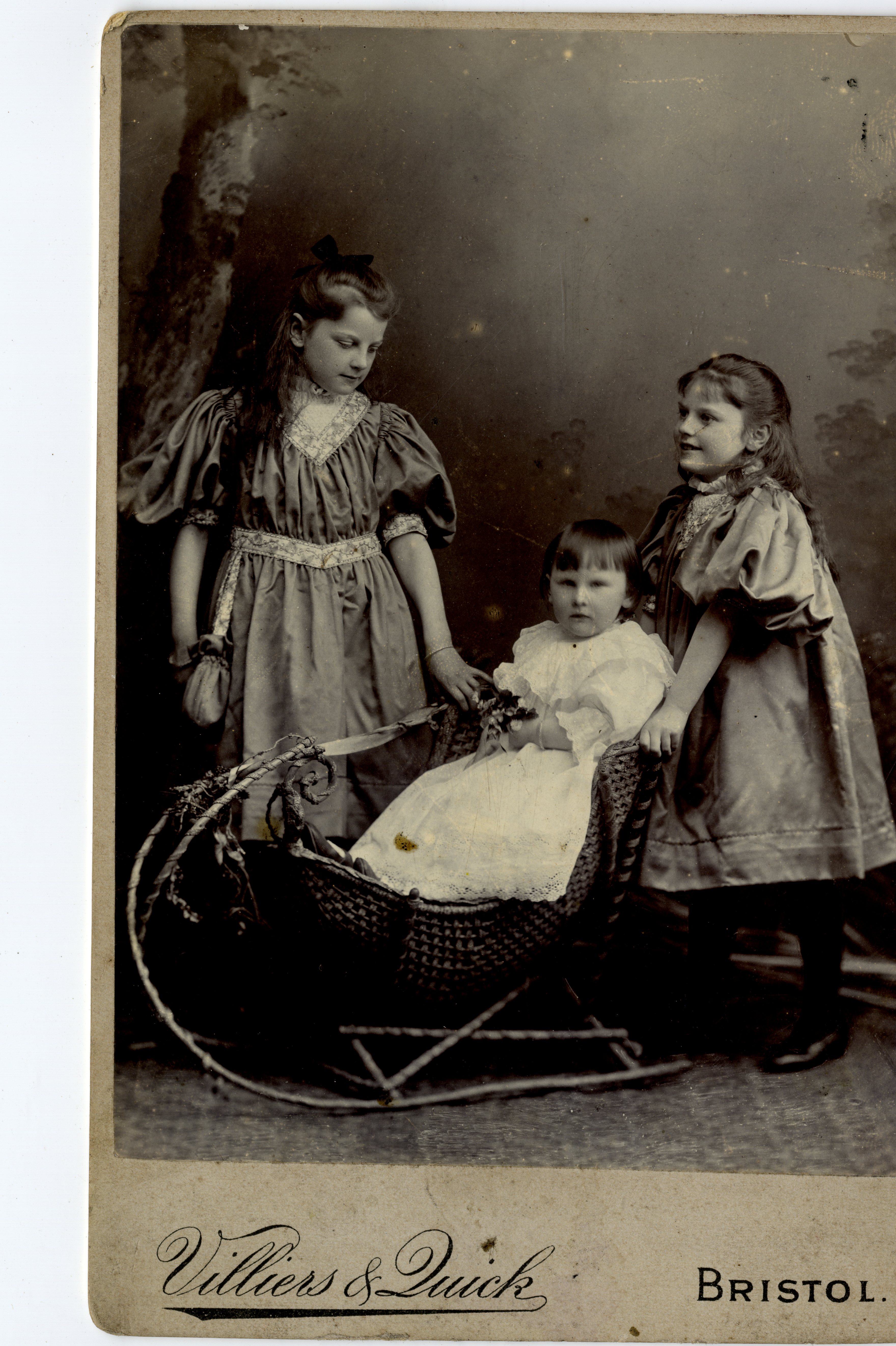 Late Victorian studio image of three children.