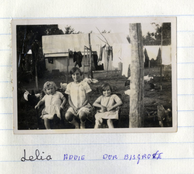 Three children in backyard