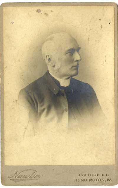 Victorian man in frock coat and dog collar