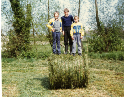 Round bale of hay with children