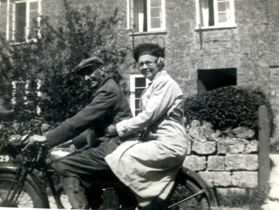 Man & woman on motorbike West Lambrook