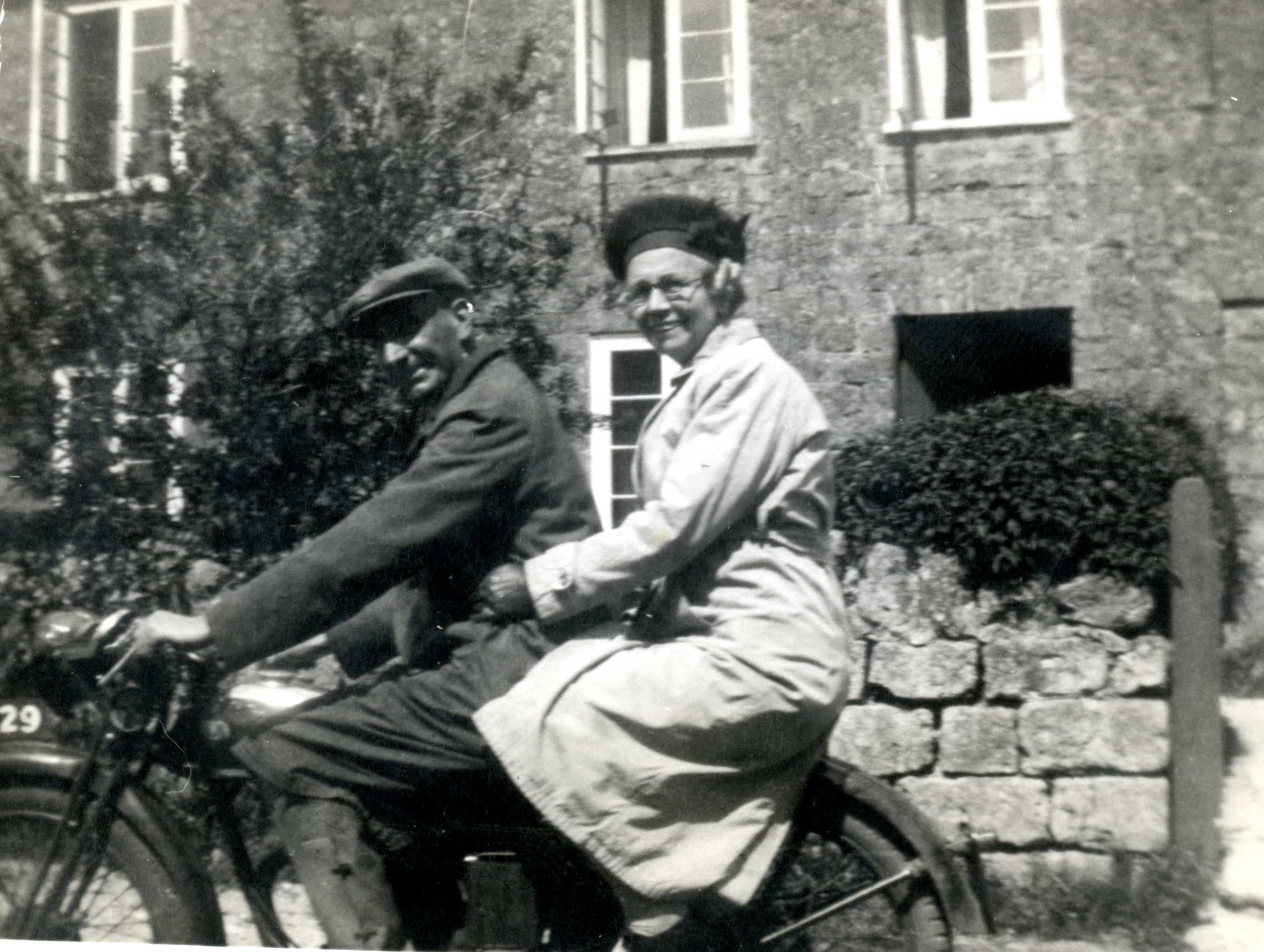 Man & woman on motorbike West Lambrook