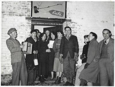 Carol singing at the Rusty Axe.