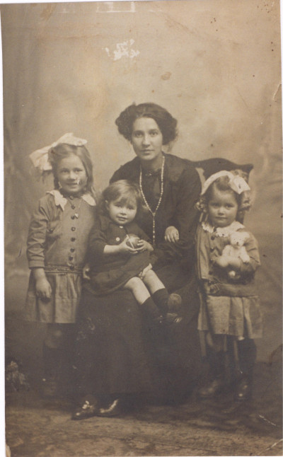 Studio picture of woman and three children