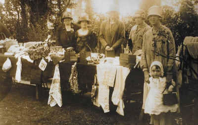Women at a fete bring & buy stall.