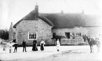 Dudmoor Corner with figures in road.